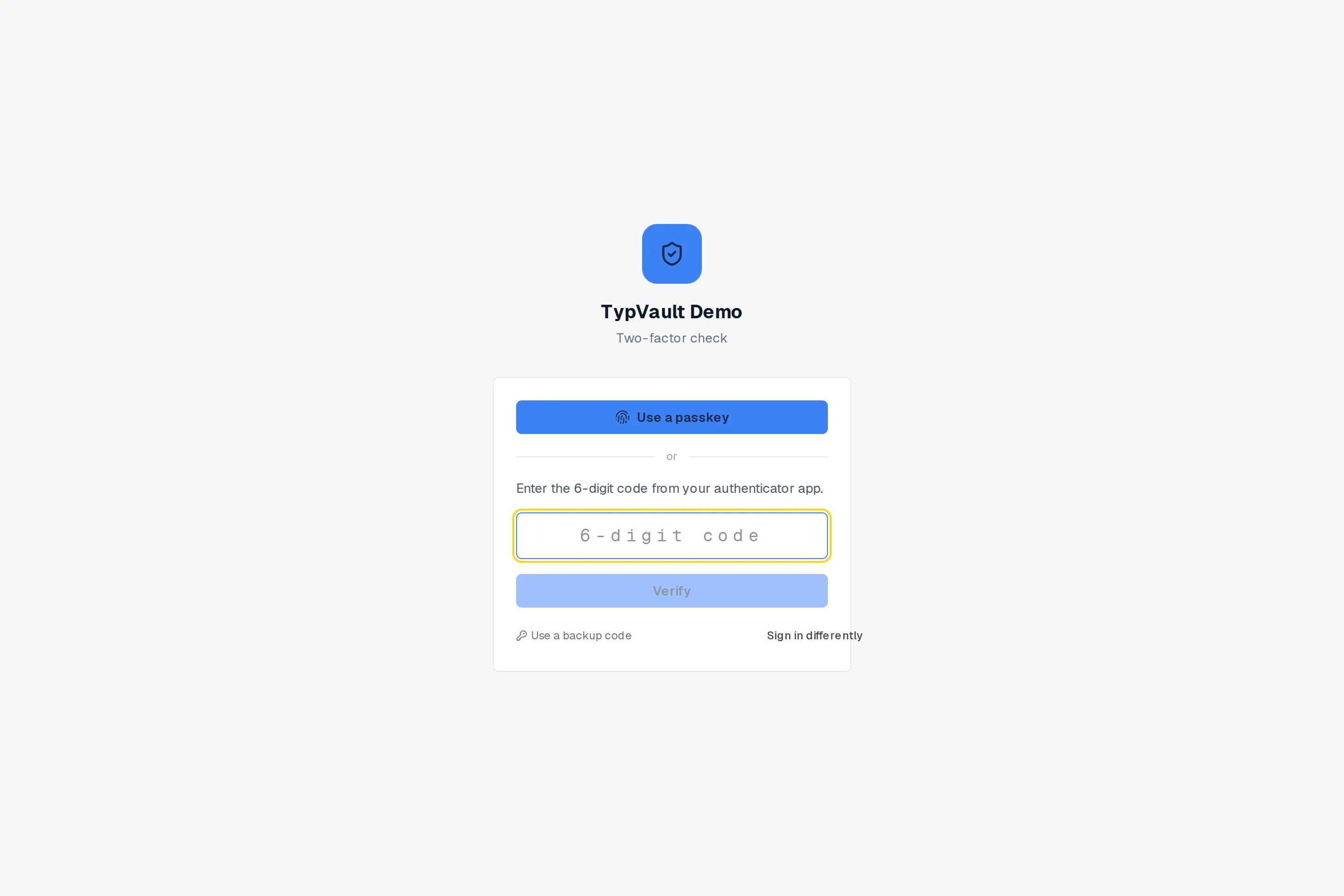 The two-factor check: a passkey button, or a field for the 6-digit code from an authenticator app.